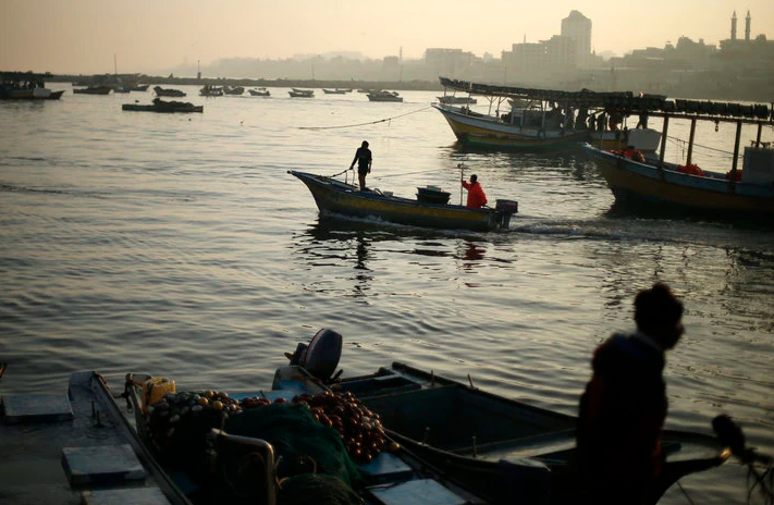 Palestinian fishermen ride their boat at the Seaport of Gaza City April 4, 2016. On April 3, 2016, Israel extended the distance it permits Gaza fishermen to head out to sea along certain parts of the coastline of the enclave, which is run by the Islamist group Hamas. REUTERS/Suhaib Salem